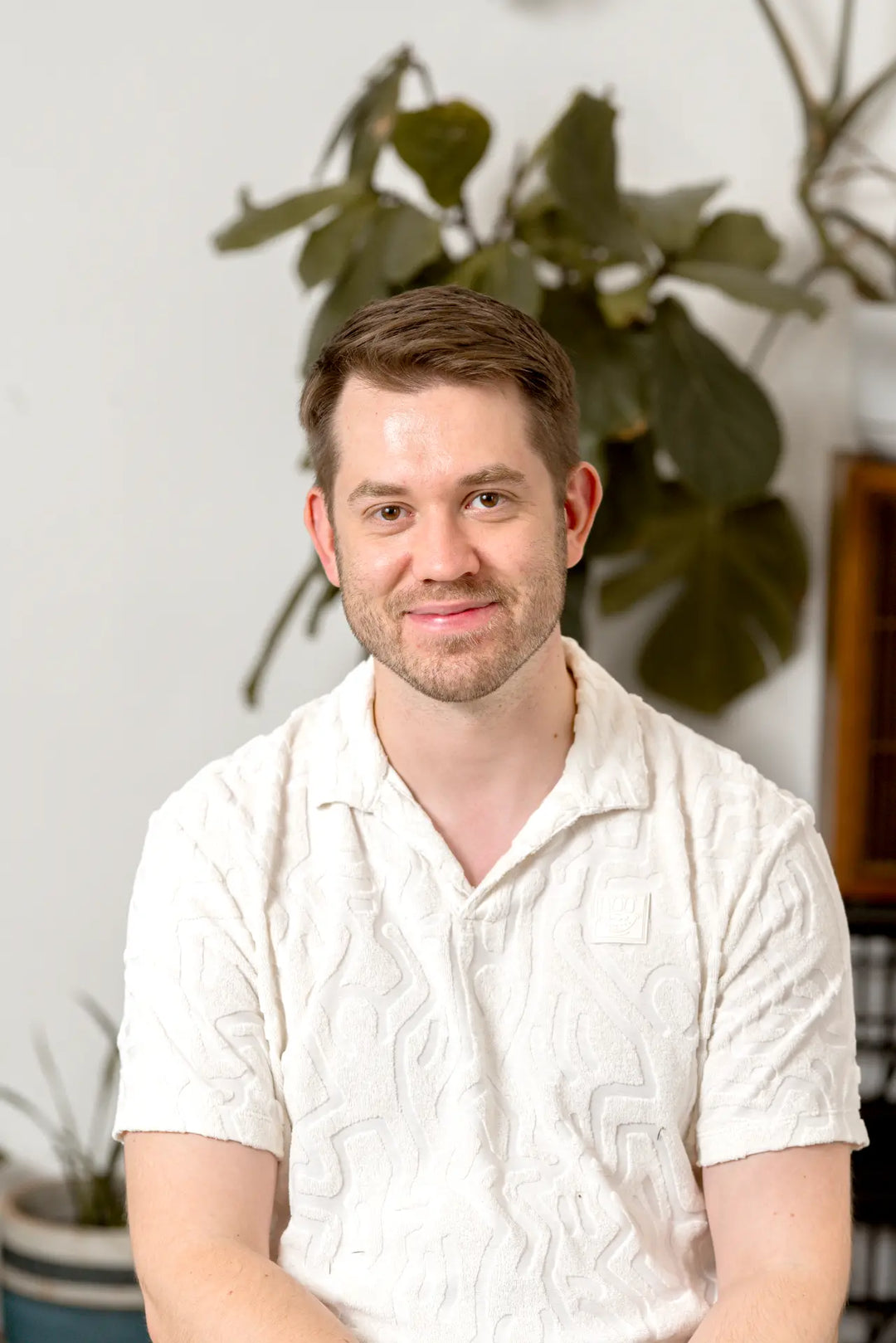 One of the founders of Earthrise coffee alternative, named Adam, smiling at the camera
