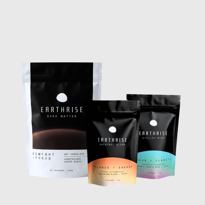 Three Earthrise coffee packages on a light gray background